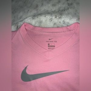 Pink NIKE shirt, is for a youth L, fits woman size Small